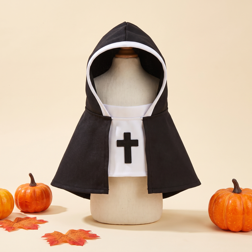 Pet nun costume with hood, cape and cross bib on a cream background